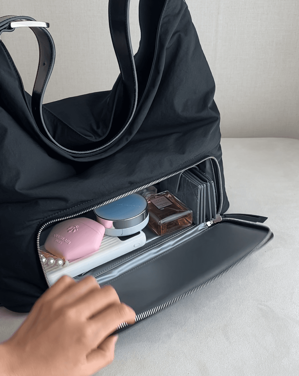 Nylon Hobo Bag — packing cosmetics in the lower compartment