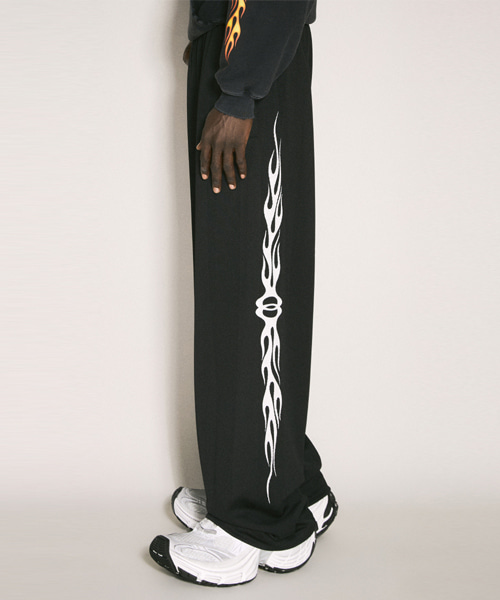 버닝 유니티 배기 트랙팬츠