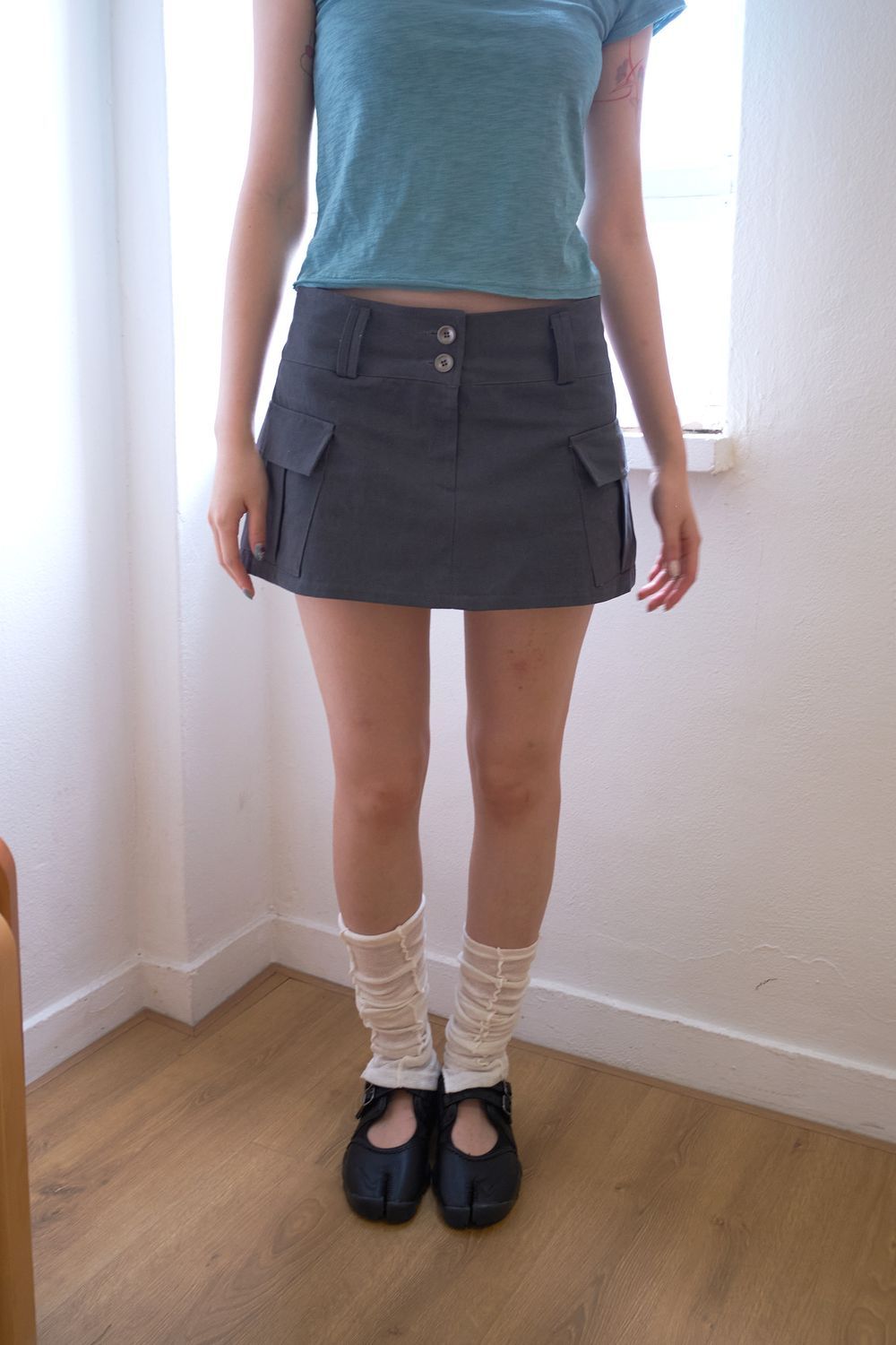 Pigment Cargo Mini Skirt - 피그먼트 워싱과 카고 포켓 디테일이 돋보이는 미니 스커트 제품 이미지